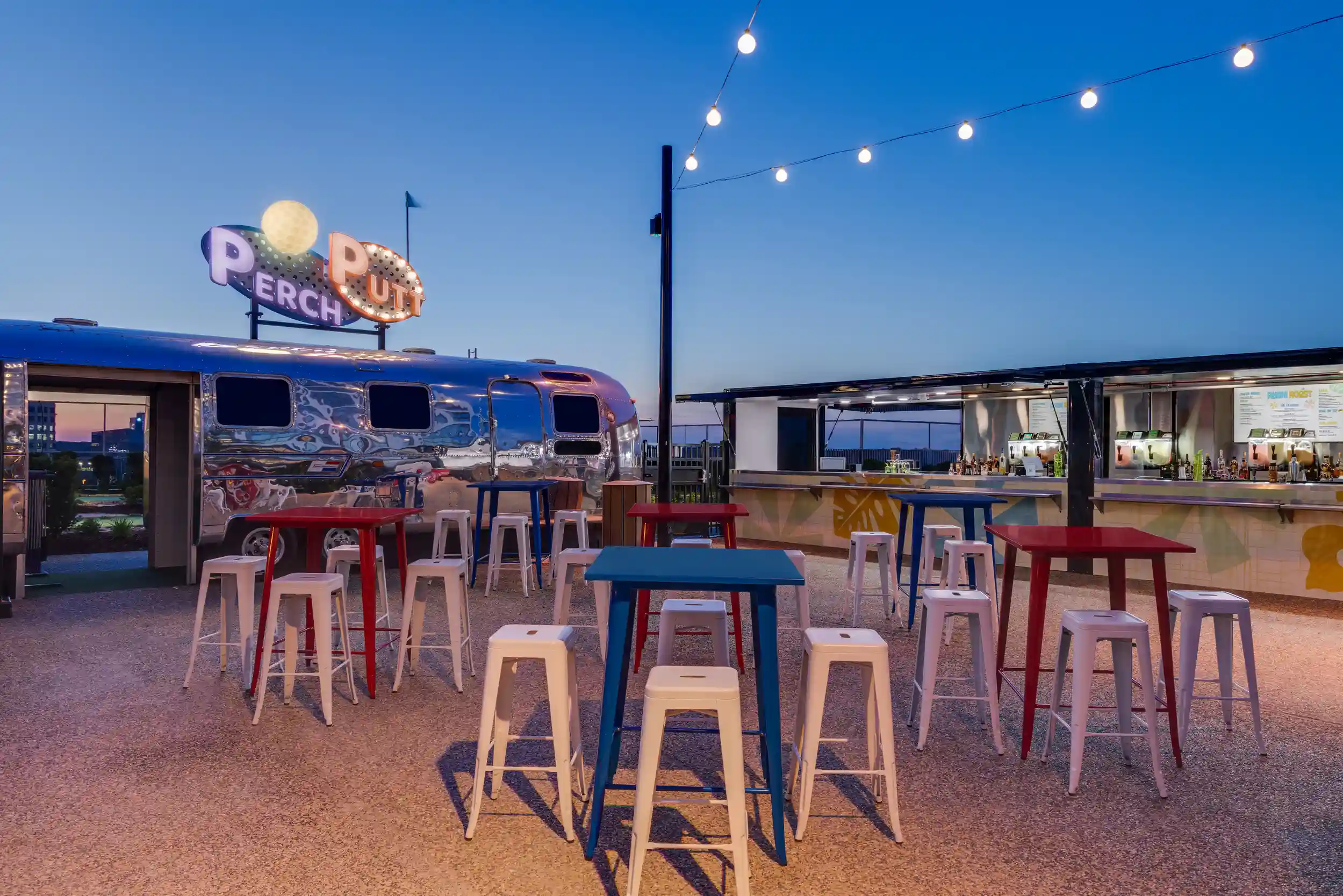 Guests hanging out on the rooftop at Perch Putt